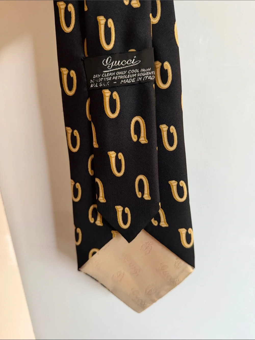Gucci Black Silk Tie with Gold Horseshoe Motif